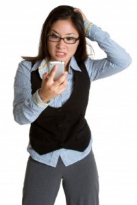 Business Woman frustrated with smartphone